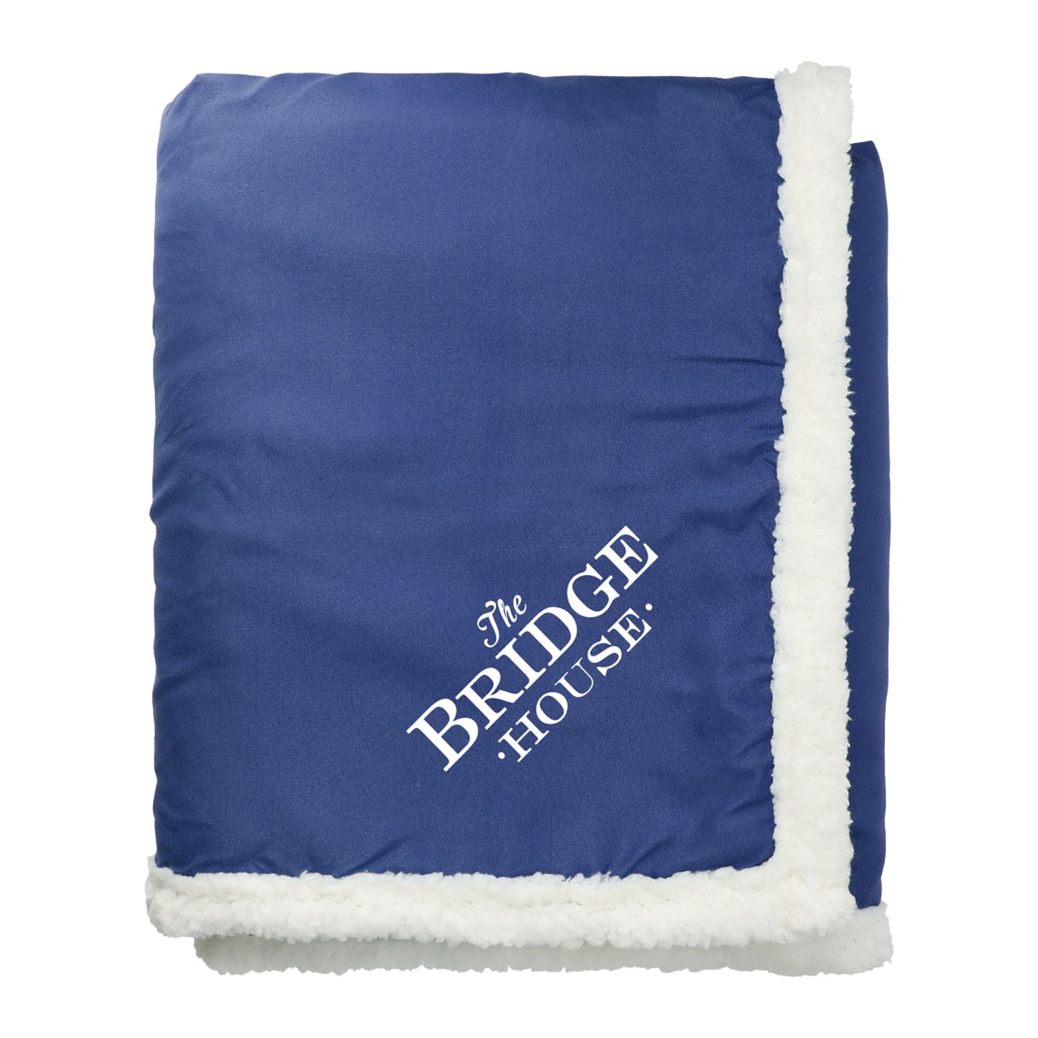 Blue blanket with white trim and 'The Bridge House' logo on a white background