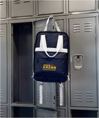 Navy Varsity Backpack Hanging on a Locker