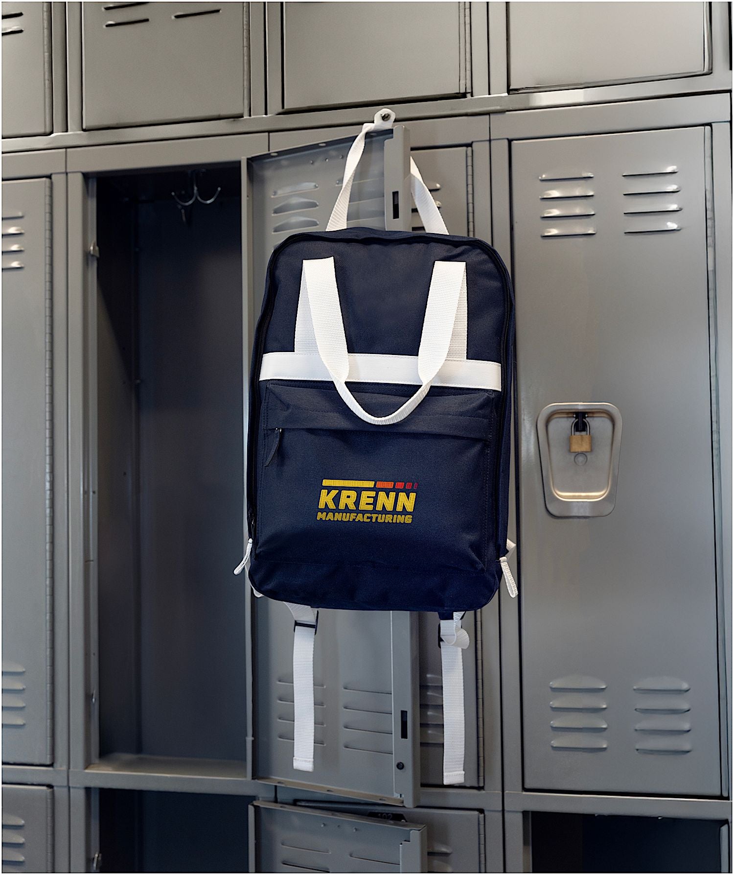 Navy Varsity Backpack Hanging on a Locker